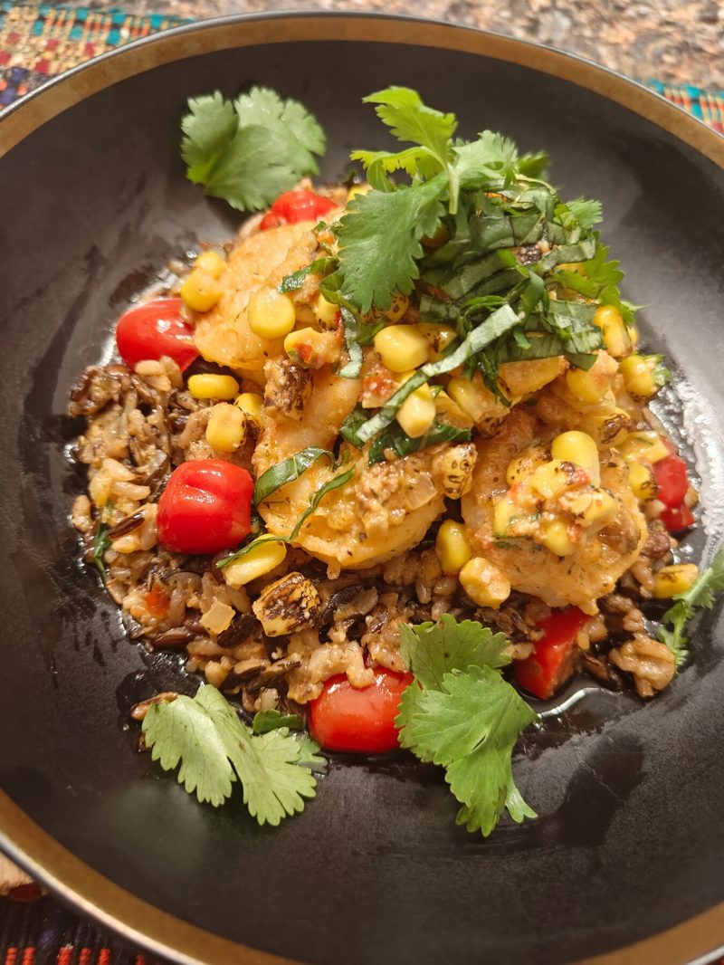 Corn and shrimp over wild rice plated by Chef Brian Schultze, private chef.